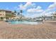 Enjoy the community pool featuring a brick pool deck and water views at 3322 Purple Martin Dr # 127, Punta Gorda, FL 33950