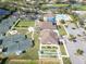 Aerial view of community center, tennis courts, lawn bowling, and parking at 3393 Grand Vista Ct # 101, Port Charlotte, FL 33953