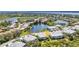 Scenic aerial view of condo community with surrounding lakes, golf course, and lush greenery at 3393 Grand Vista Ct # 101, Port Charlotte, FL 33953