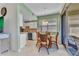 Bright kitchen featuring an adjacent dining area and easy access to outdoor screened patio at 3393 Grand Vista Ct # 101, Port Charlotte, FL 33953