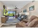 Comfortable living room with sliding glass doors that lead to outdoor patio at 3393 Grand Vista Ct # 101, Port Charlotte, FL 33953
