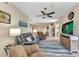 Comfortable living room features stylish furnishings and decor; view of study at 3393 Grand Vista Ct # 101, Port Charlotte, FL 33953