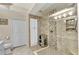 Modern bathroom featuring a walk-in shower with custom tile work, built-in niche, and glass enclosure at 3393 Grand Vista Ct # 101, Port Charlotte, FL 33953