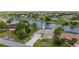 Beautiful waterfront home features a screened-in pool, lush landscaping, and a private dock for easy access to the canal at 380 Concordia St, Punta Gorda, FL 33983