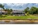 A waterfront home featuring a screened lanai with a pool, perfect for outdoor enjoyment at 380 Concordia St, Punta Gorda, FL 33983
