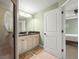 Well-lit bathroom complete with granite counters, dual sinks, and a shower at 380 Concordia St, Punta Gorda, FL 33983