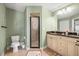 Elegant bathroom features granite counters, dual sinks, and glass enclosed shower at 380 Concordia St, Punta Gorda, FL 33983