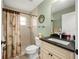 Cozy bathroom complete with a sink, toilet, neutral wall color, and tile floors at 380 Concordia St, Punta Gorda, FL 33983