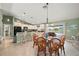 Dining area featuring a table with seating for six, with bar seating at the kitchen counter at 380 Concordia St, Punta Gorda, FL 33983
