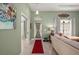 Inviting home foyer with neutral walls, tile flooring and a decorative front door at 380 Concordia St, Punta Gorda, FL 33983
