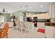 Kitchen with bar seating, stainless steel appliances, and modern lighting fixtures at 380 Concordia St, Punta Gorda, FL 33983