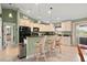 Kitchen with bar seating and black appliances at 380 Concordia St, Punta Gorda, FL 33983