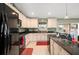 Kitchen with black appliances and stylish countertops at 380 Concordia St, Punta Gorda, FL 33983