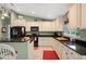 Well-appointed kitchen with black appliances, ample counter space, and modern decor at 380 Concordia St, Punta Gorda, FL 33983