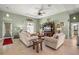 Inviting living room featuring tray ceilings, comfortable seating, and a media center at 380 Concordia St, Punta Gorda, FL 33983
