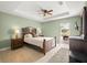 Spacious main bedroom boasts tray ceiling, tile floors, and patio access at 380 Concordia St, Punta Gorda, FL 33983