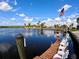 Property features a private dock with seating and stunning waterfront views at 4242 Rose Arbor Cir, Port Charlotte, FL 33948