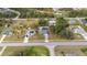 This aerial showcases the charming home and yard in its neighborhood setting, surrounded by trees at 4373 Atwater Dr, North Port, FL 34288