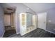 Mud room featuring a seating area with a bookcase, gray walls, and wood-look floors at 4373 Atwater Dr, North Port, FL 34288