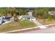 Charming single-story home with manicured lawn and paver driveway, surrounded by lush greenery at 4373 Atwater Dr, North Port, FL 34288