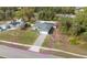 Well-maintained single-Gathering home featuring a green lawn, landscaping, and paved driveway in a serene setting at 4373 Atwater Dr, North Port, FL 34288