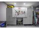Organized garage featuring custom cabinets, work bench, tool rack, and epoxy flooring at 4373 Atwater Dr, North Port, FL 34288