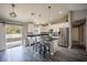 Bright, open kitchen with stainless steel appliances, granite countertops, a stylish island, and luxury vinyl plank flooring at 4373 Atwater Dr, North Port, FL 34288