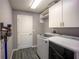 Functional laundry room with modern washer, dryer, and ample storage cabinets at 4373 Atwater Dr, North Port, FL 34288
