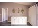 Built-in hutch with luxury vinyl plank flooring near barn door with modern photos hung above the hutch at 4373 Atwater Dr, North Port, FL 34288