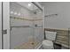 Bathroom with glass enclosed shower, tiled floor, and modern fixtures at 628 Tarpon Way, Punta Gorda, FL 33950