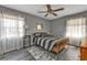 Comfortable bedroom with natural light, ceiling fan, and neutral decor creates a relaxing atmosphere at 628 Tarpon Way, Punta Gorda, FL 33950