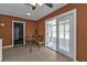 Dining area featuring a built-in bench, access to a sunroom, and a cozy atmosphere at 628 Tarpon Way, Punta Gorda, FL 33950
