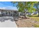 Well-maintained front yard with a driveway, landscaping, and a clear view of the home's exterior at 628 Tarpon Way, Punta Gorda, FL 33950
