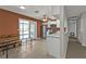 Eat-in Kitchen featuring stainless steel appliances, white cabinets, and a sliding glass door at 628 Tarpon Way, Punta Gorda, FL 33950