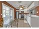 Well-lit kitchen includes stainless appliances, white cabinets, and a sunroom view at 628 Tarpon Way, Punta Gorda, FL 33950