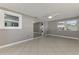 This is a bedroom featuring tile floors, neutral-colored walls, and a ceiling fan for a bright and airy space at 760 Devon Rd, Venice, FL 34293