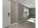 The entryway offers easy access into the main living area featuring tile flooring and a large window at 760 Devon Rd, Venice, FL 34293