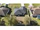 Aerial shot of a fenced backyard and outdoor space featuring a well-kept lawn at 7794 Einstein St, North Port, FL 34291