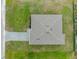 Aerial view of home featuring an attractive roof and paved driveway at 12156 Wellington Ave, Port Charlotte, FL 33981