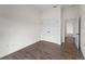 Bright bedroom with a double door closet and wood-look tile flooring at 12156 Wellington Ave, Port Charlotte, FL 33981