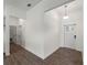 Bright entryway with a stylish light fixture and access to various rooms of the house at 12156 Wellington Ave, Port Charlotte, FL 33981