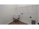 Functional laundry room with a utility sink, shelving, and tile floors at 12156 Wellington Ave, Port Charlotte, FL 33981