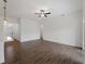 Spacious living room with tile floors and a ceiling fan, providing a comfortable and modern living space at 12156 Wellington Ave, Port Charlotte, FL 33981