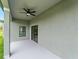 A gray-toned covered back patio space perfect for outdoor living at 12156 Wellington Ave, Port Charlotte, FL 33981
