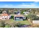 Backyard aerial view showcasing a pool and lush greenery at 14319 Allensworth Ave, Port Charlotte, FL 33981