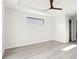 Bright, airy bedroom with wood-look flooring and a modern ceiling fan at 14319 Allensworth Ave, Port Charlotte, FL 33981