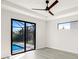 Bedroom with sliding glass doors leading to the screened lanai and pool at 14319 Allensworth Ave, Port Charlotte, FL 33981