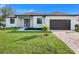 Charming single-story home with a well-manicured lawn and modern design at 14319 Allensworth Ave, Port Charlotte, FL 33981