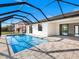 Beautiful screened-in pool area, perfect for relaxation and entertaining at 14319 Allensworth Ave, Port Charlotte, FL 33981