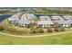 Aerial view of condo buildings surrounded by a golf course and ponds at 14640 Sycamore Ct # 2812, Punta Gorda, FL 33955